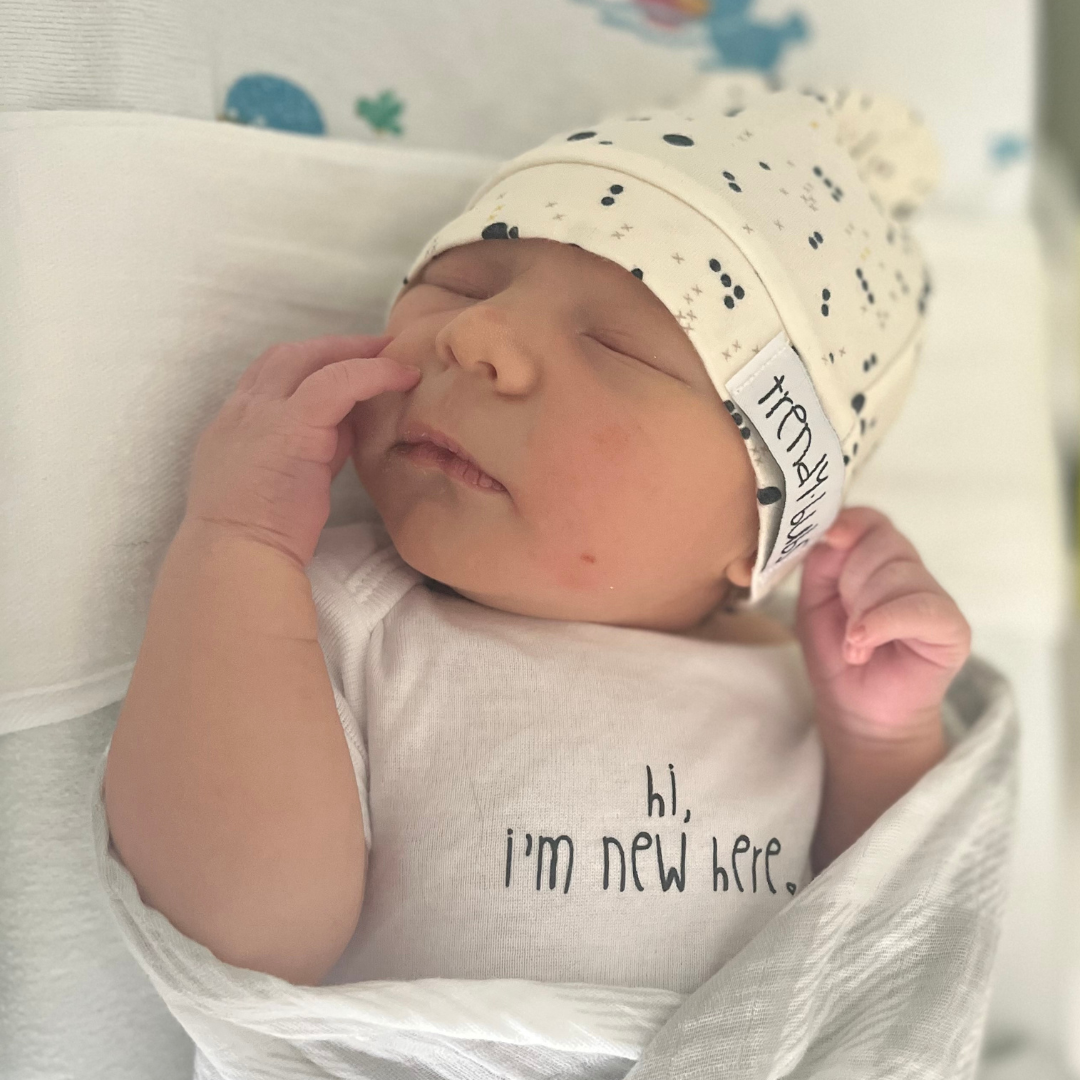 "Hi, I'm New Here" onesie
